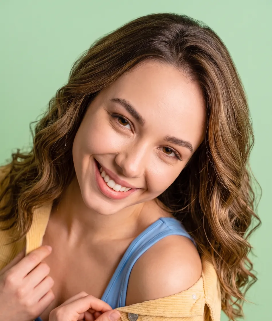 Smiling woman with long wavy hair