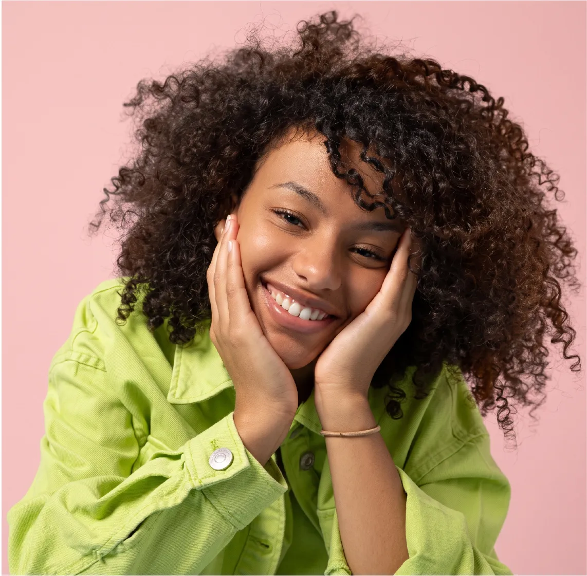 Smiling woman with coily hair